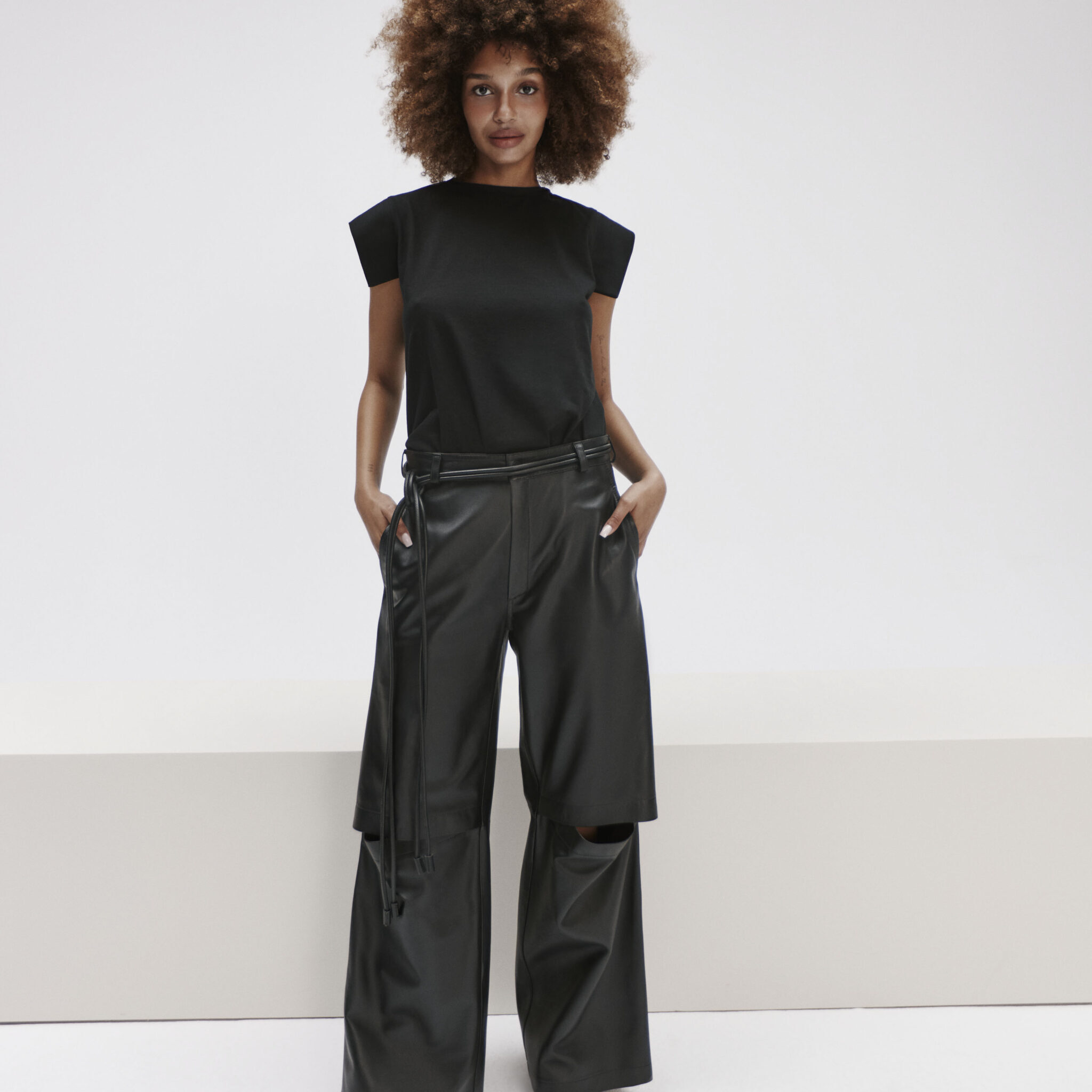 wide leg leather pants with cutouts at the knees
